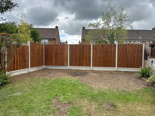 New closeboard fencing on concrete posts turning the corner of a rear garden